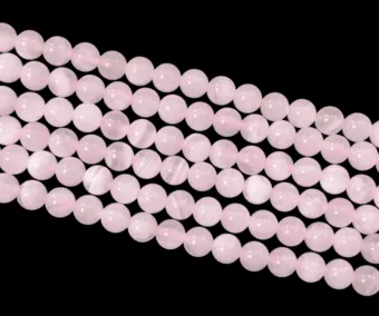 Calcite rosa AA 6mm su filo da 40cm