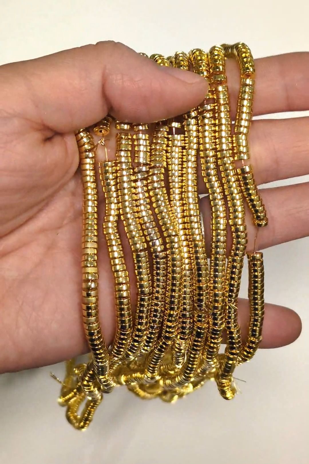 Perline distanziatrici in ematite dorata – 4×1 mm