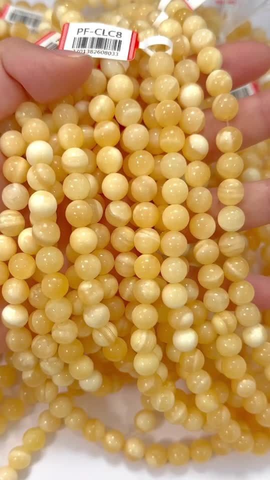 Perle di calcite arancione da 8-8.5 mm su filo da 40 cm